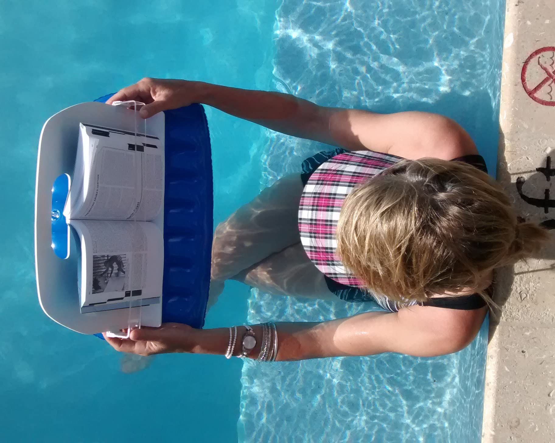AquaReader hand resting on board to show reduced arm strain while reading benefit