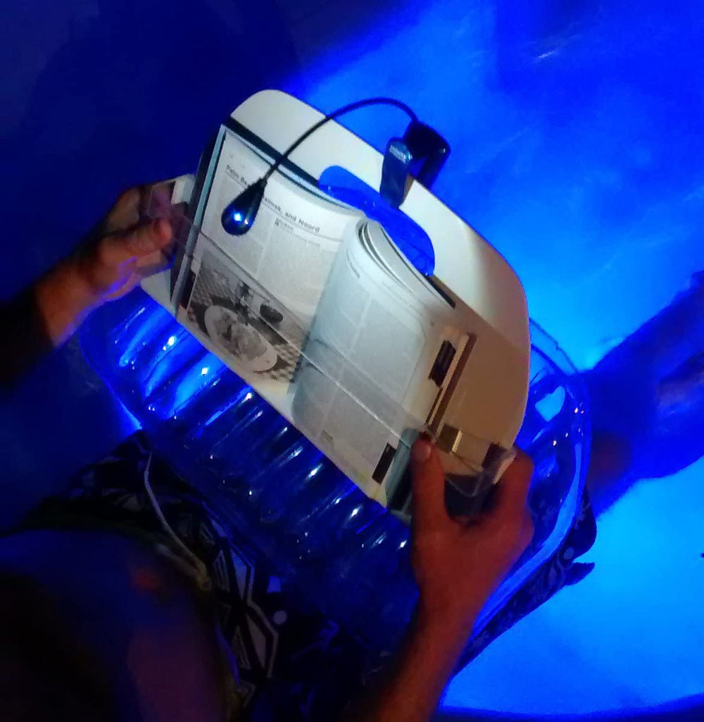 AquaReader packed flat in a suitcase highlighting portability and travel convenience