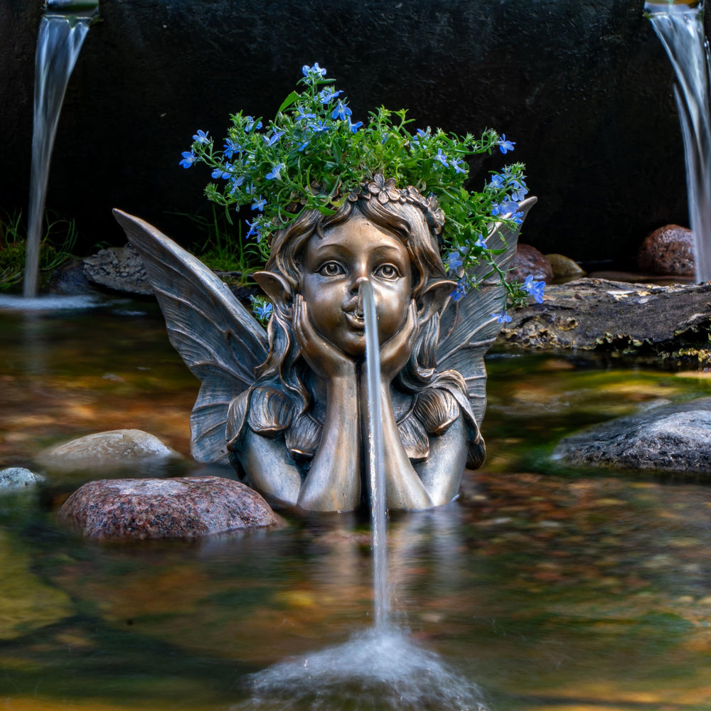 Aquascape fairy planter closeup of water flow from fairy mouth for gentle motion
