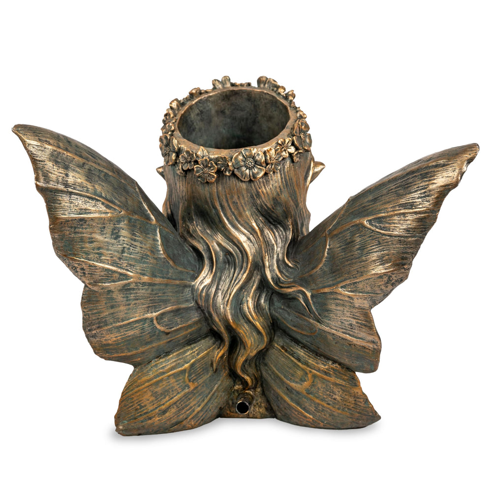 Aquascape fairy planter set in pond creating soothing sound and atmosphere