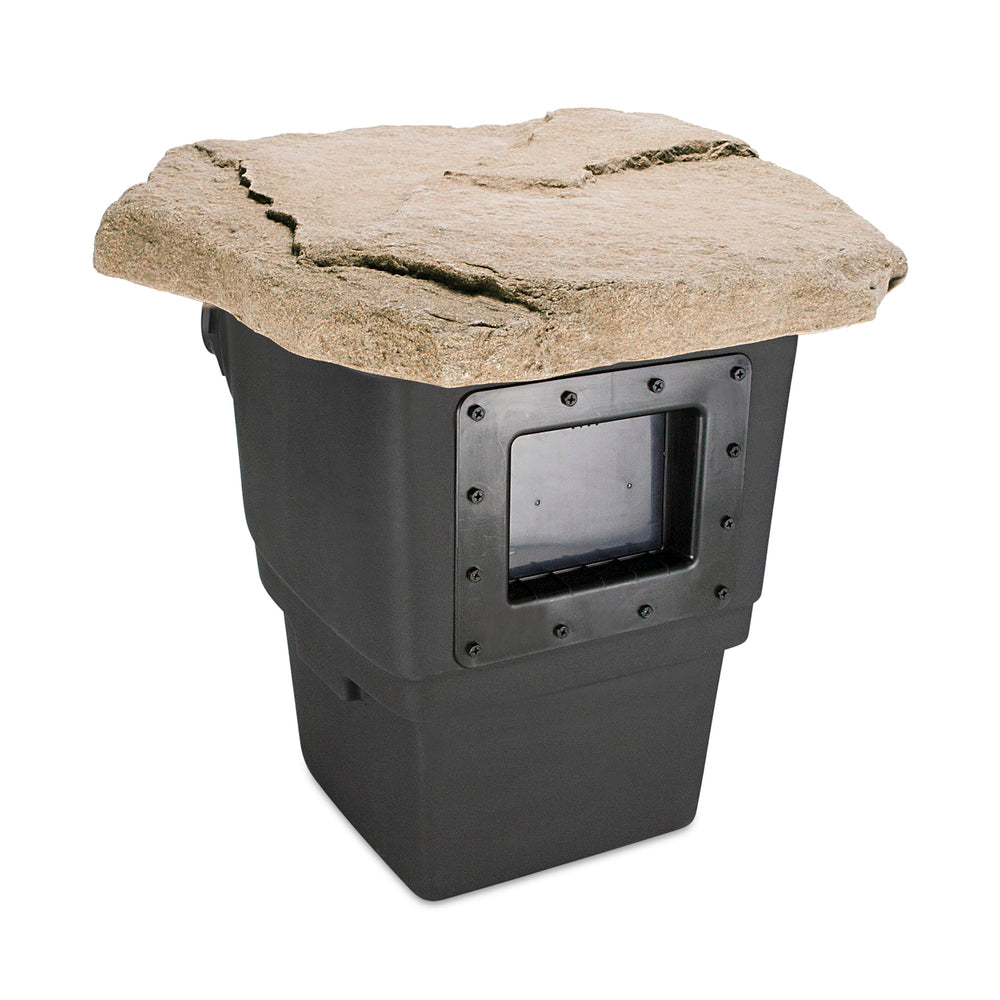 Aquascape faux-rock lid at pond edge blending with plants for seamless landscape look
