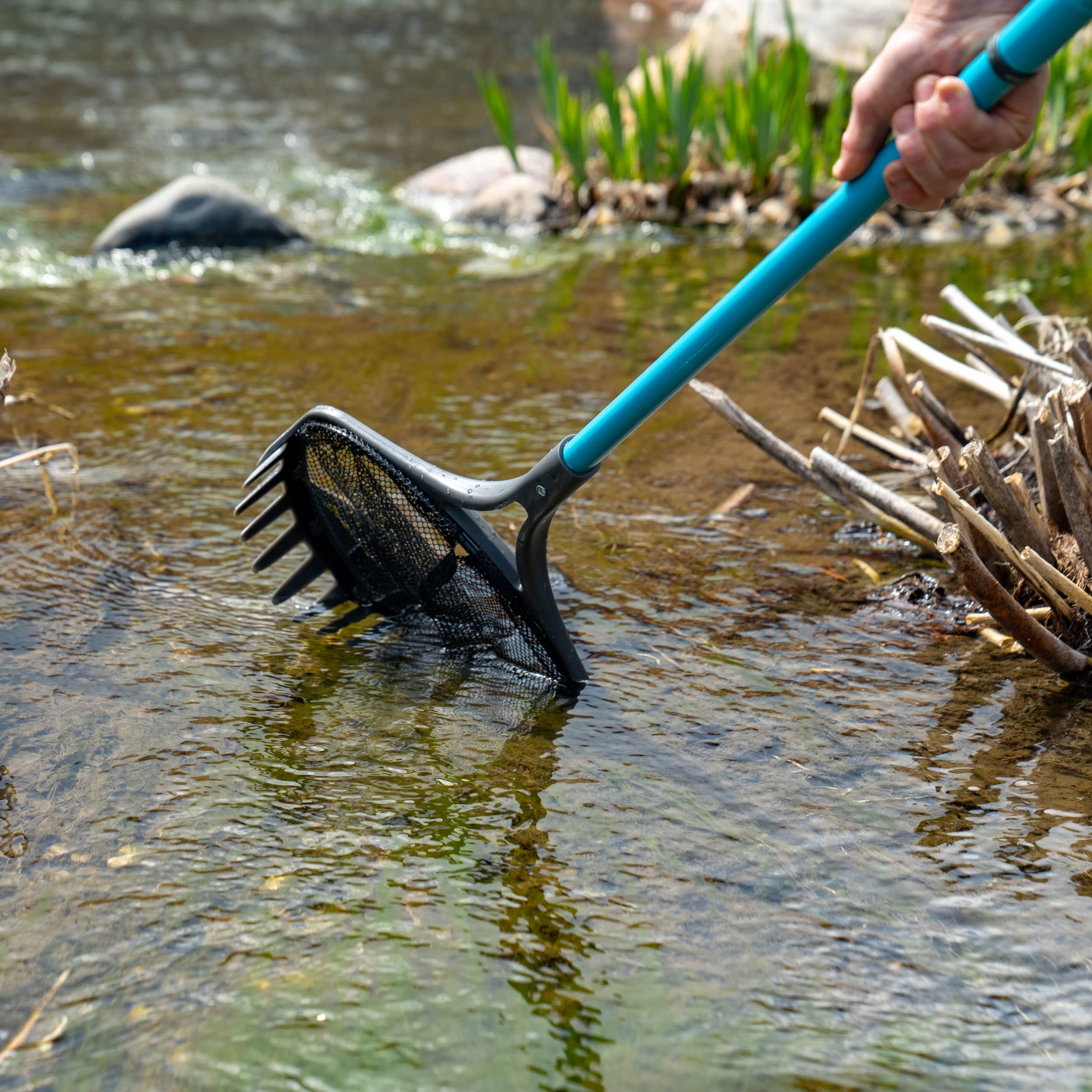 Aquascape Pond Shark fine-mesh net close-up capturing small debris for efficient skimming