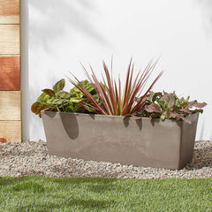 Arcadia Garden Products planted on a patio with flowers showing vibrant display and weather resistance