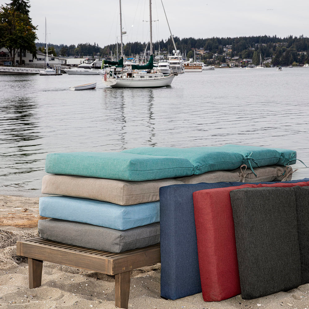 Arden Selections chaise cushion in use poolside adding vibrant comfort
