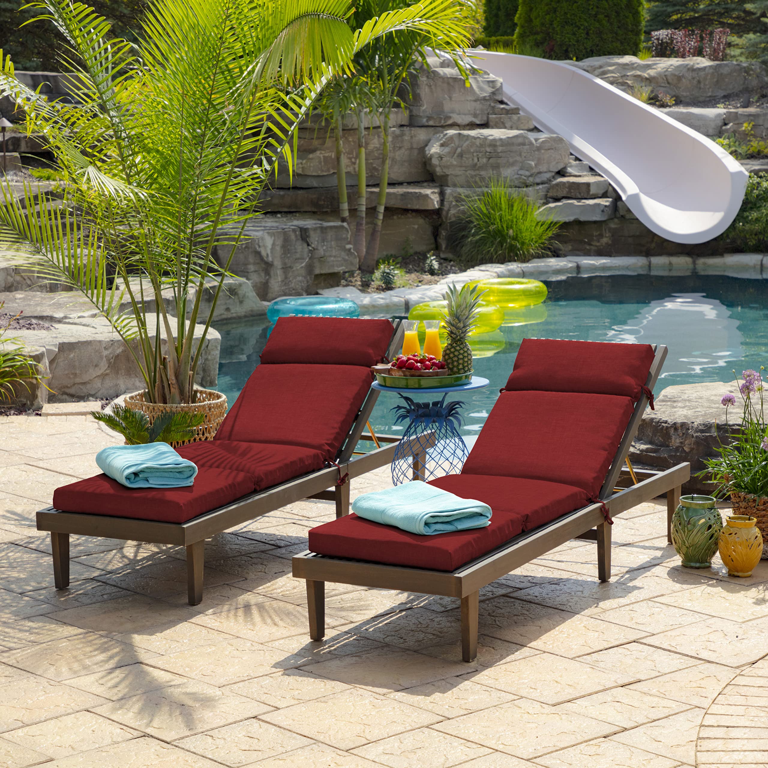 Arden Selections Ruby Red cushion on balcony setting suggesting stylish outdoor living