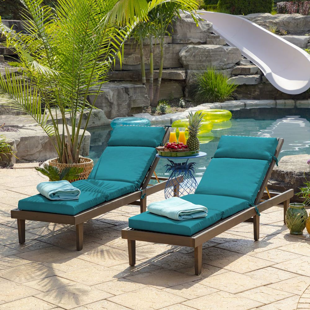 Arden Selections Lake Blue cushion displayed on wooden chaise in patio setting