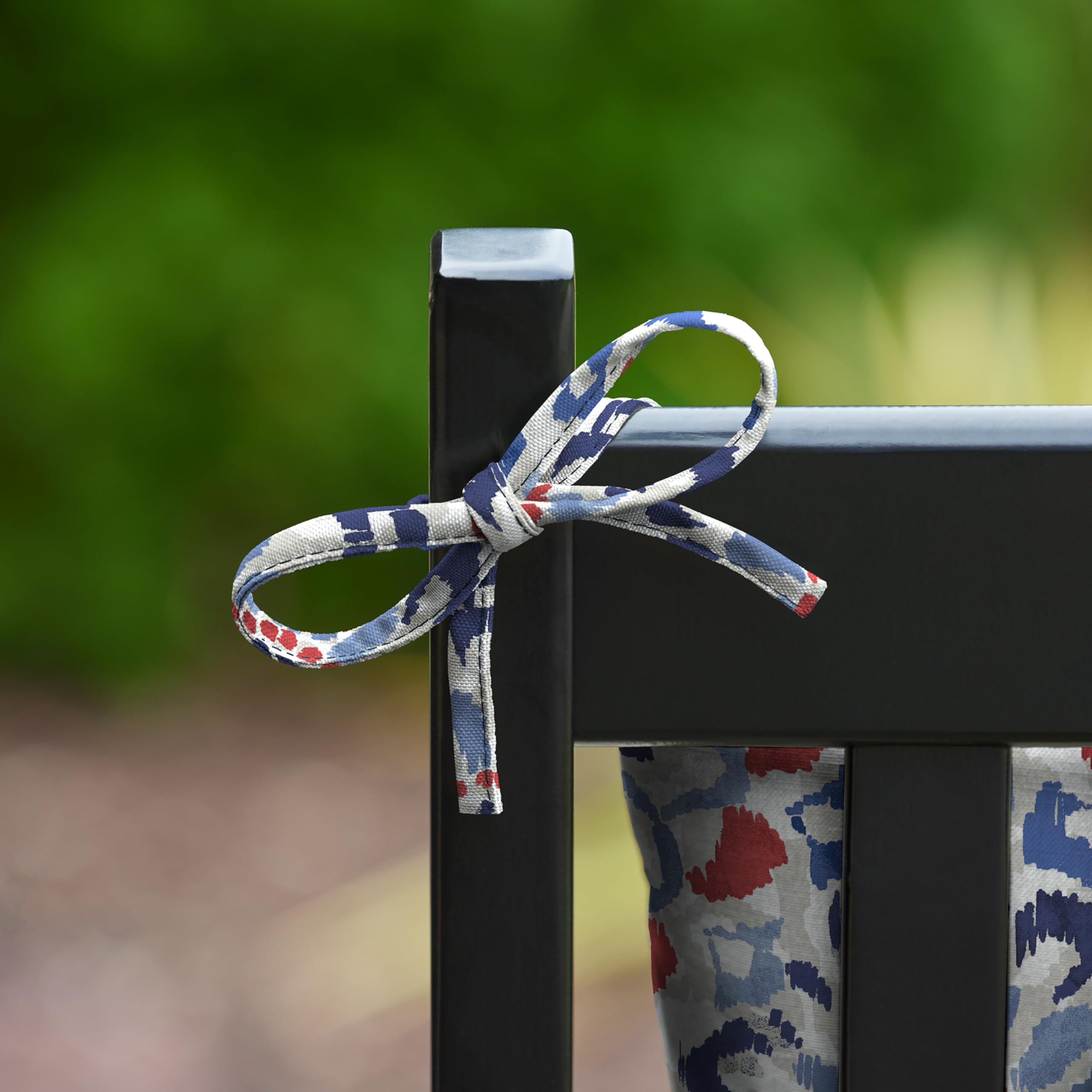 Arden Selections cushion on a porch rocker in lifestyle scene creating cozy outdoor seating