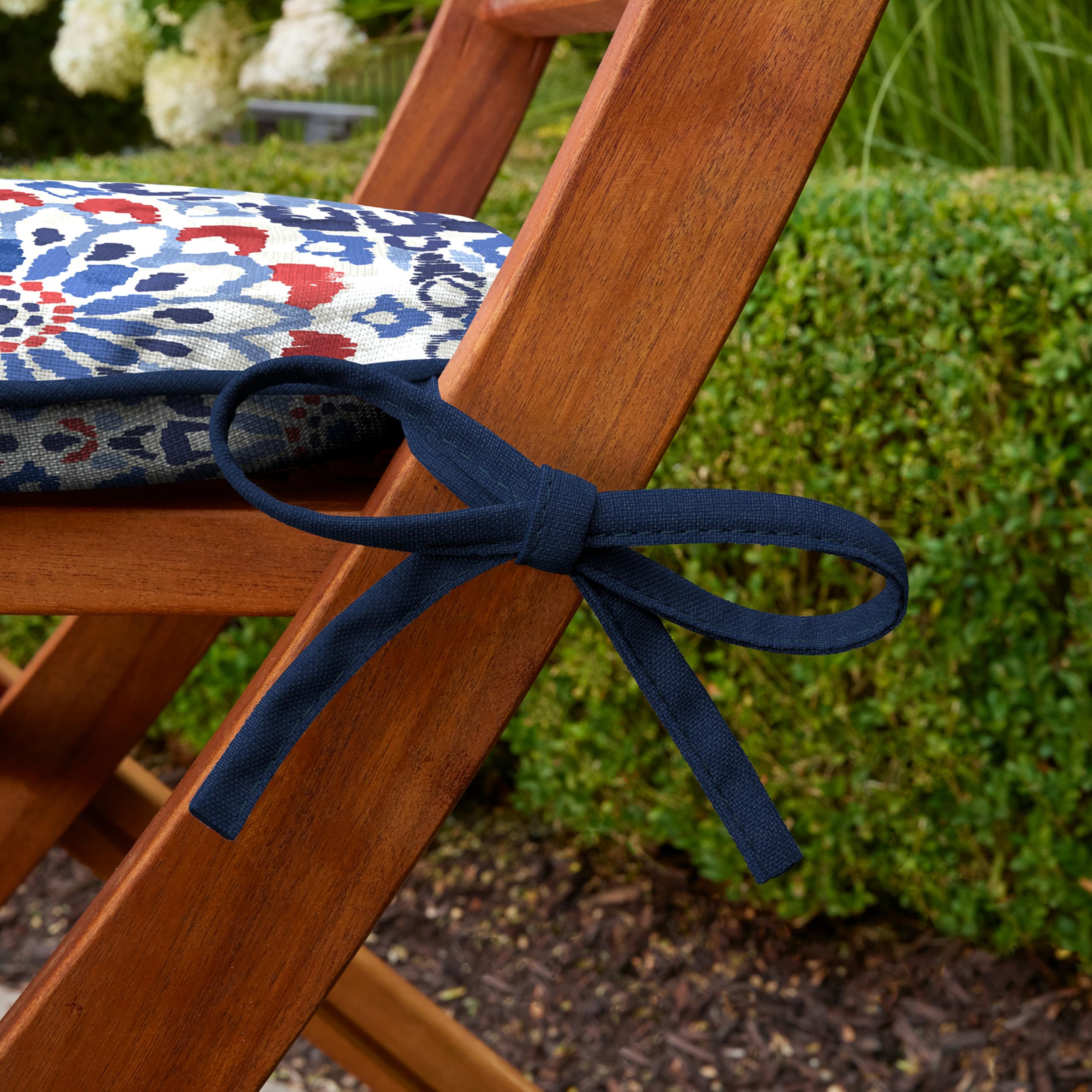 Arden Selections Clark Blue seat pad next to chair to show 17x16 inch scale