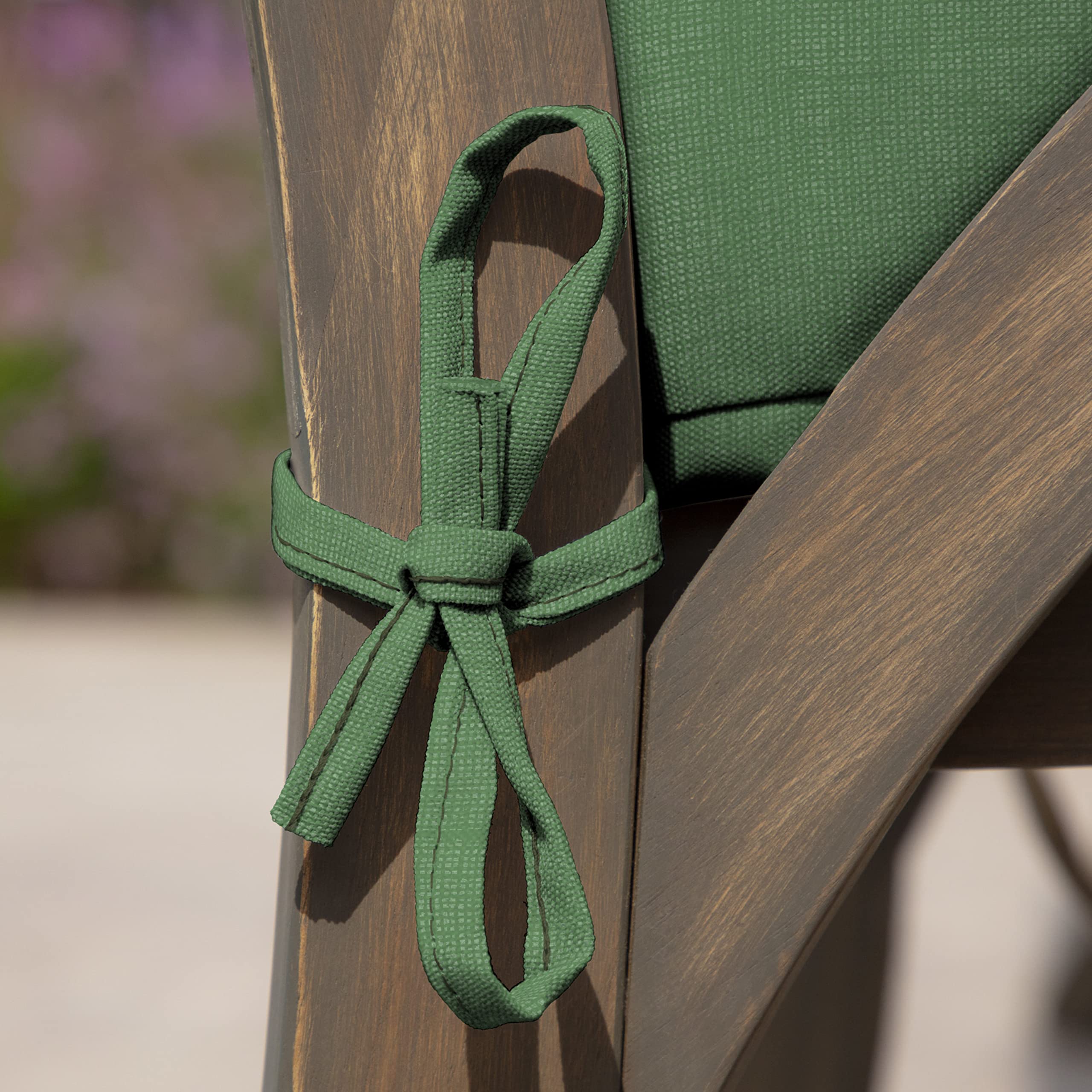 Arden Selections hand wiping cushion surface showing easy-clean, low-maintenance benefit