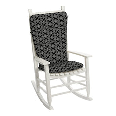 Arden Selections cushion in use on an Adirondack chair on a porch showing comfort and outdoor-ready style