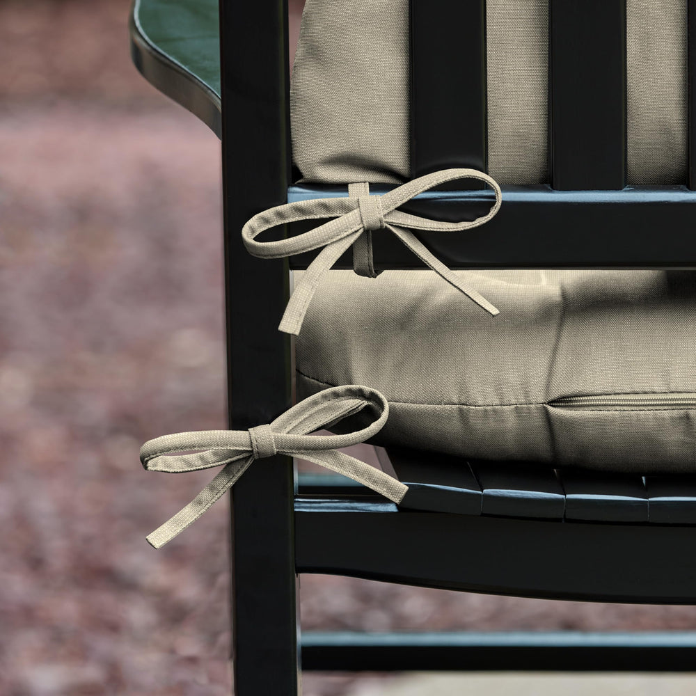 Arden Selections cushion installed on a porch rocker demonstrating comfortable outdoor use