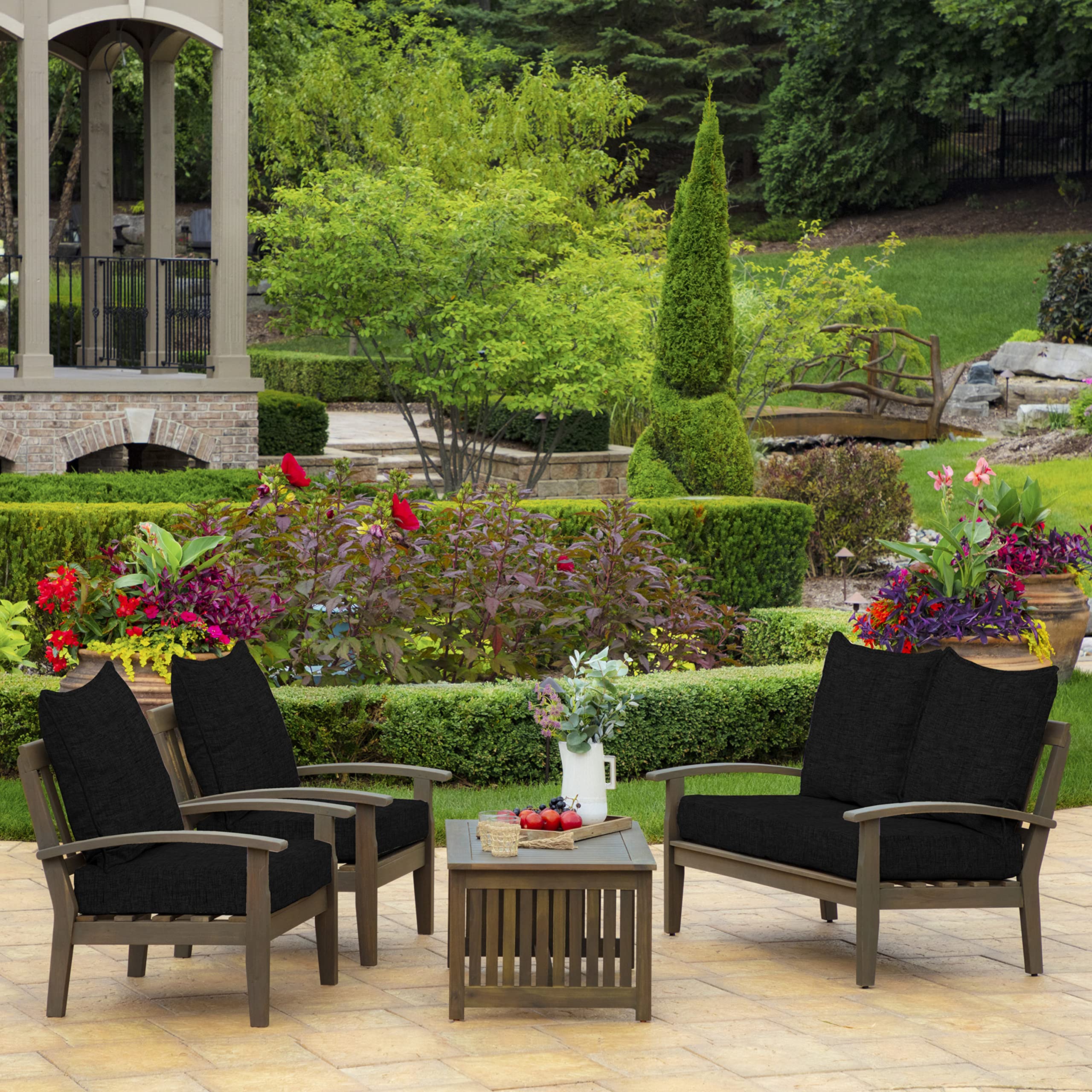 Arden Selections staged on patio sofa illustrating outdoor-ready comfort for entertaining