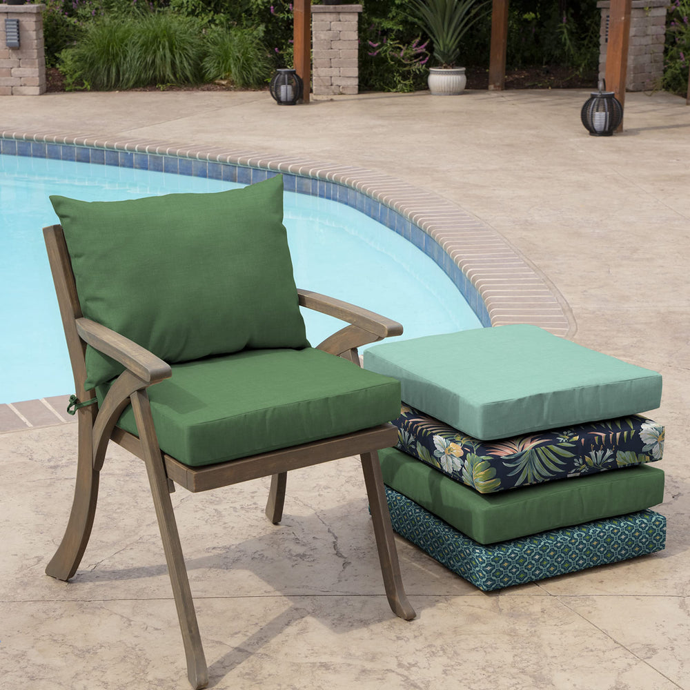 Arden Selections cushion next to standard dining chair showing true 21x21 sizing fit