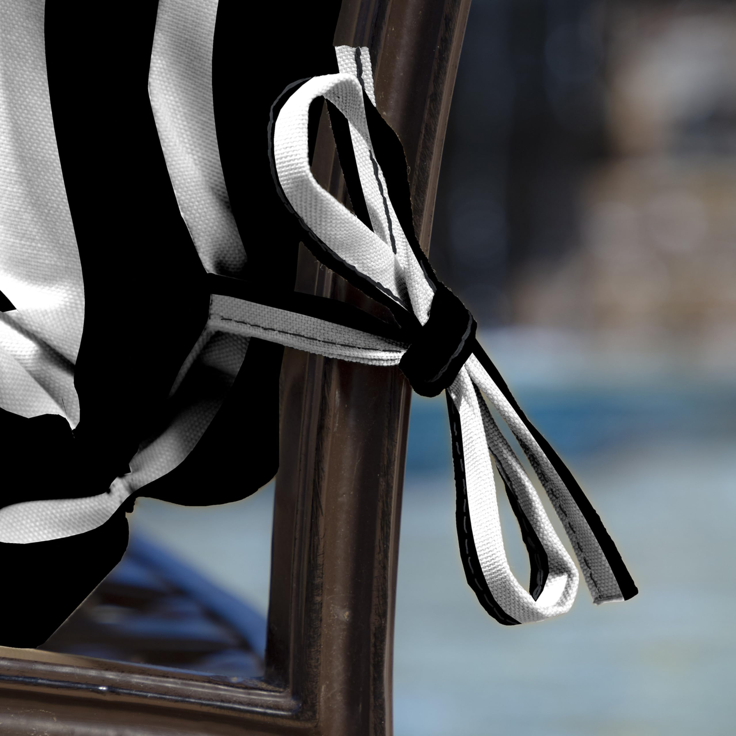 Arden Selections tie attachment closeup illustrating secure fastening to keep cushion stable