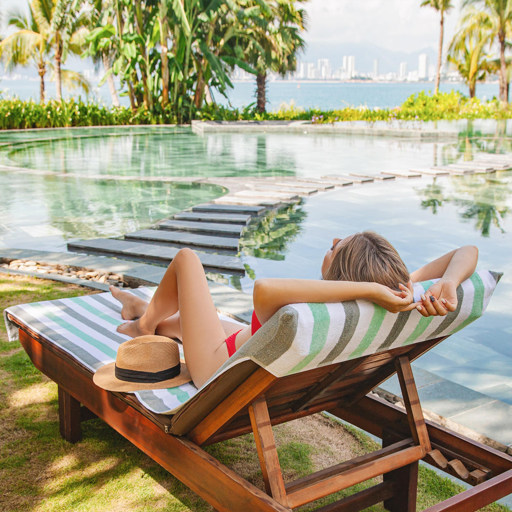 Arkwright Cabo cover draped poolside with person relaxing showing style benefit