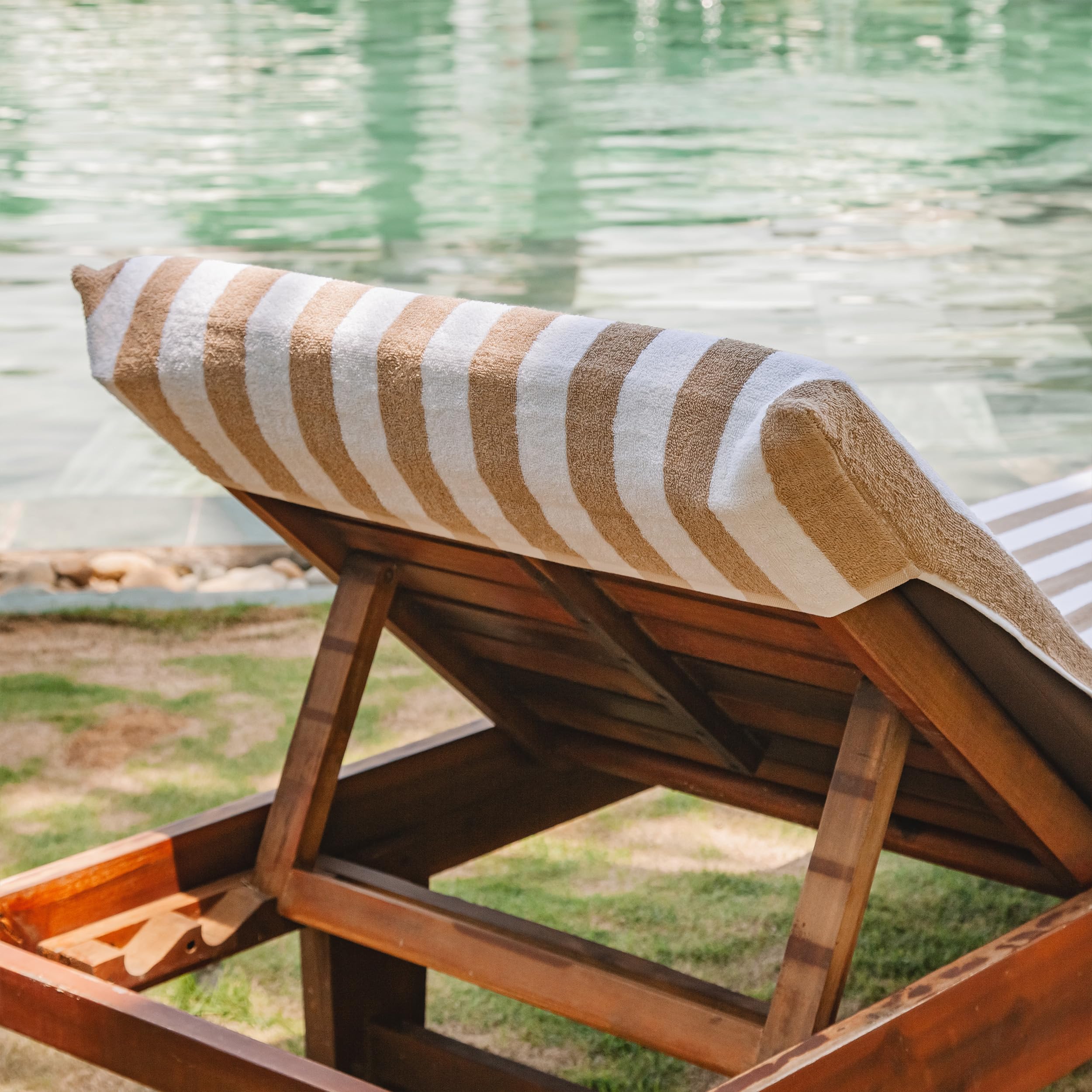 Arkwright chaise lounge with cover in use poolside offering secure, comfortable sunbathing surface