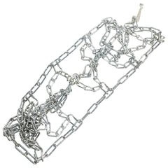 Arnold tire with chains mounted demonstrating improved traction on packed snow