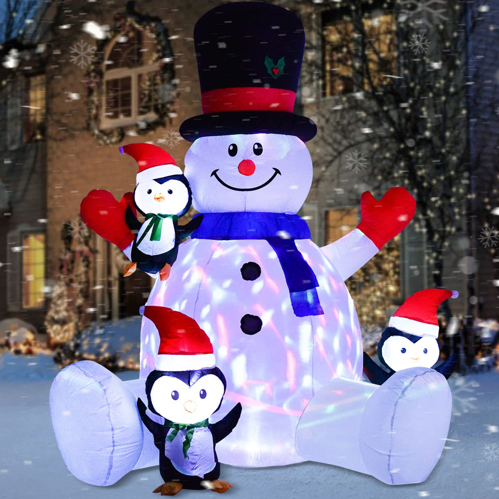 Artiflr front view inflated snowman and penguins showing festive curb appeal