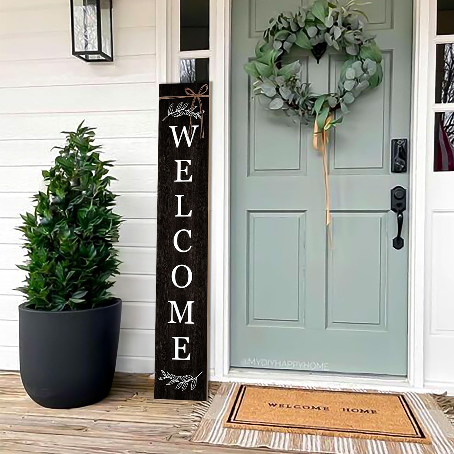 ARTUFAN lifestyle porch scene showing sign styled with plants for seasonal appeal