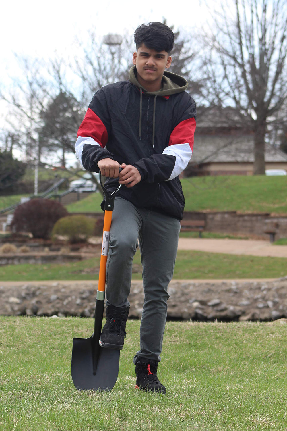 Ashman shovel scooping compost showing efficient material transfer benefit