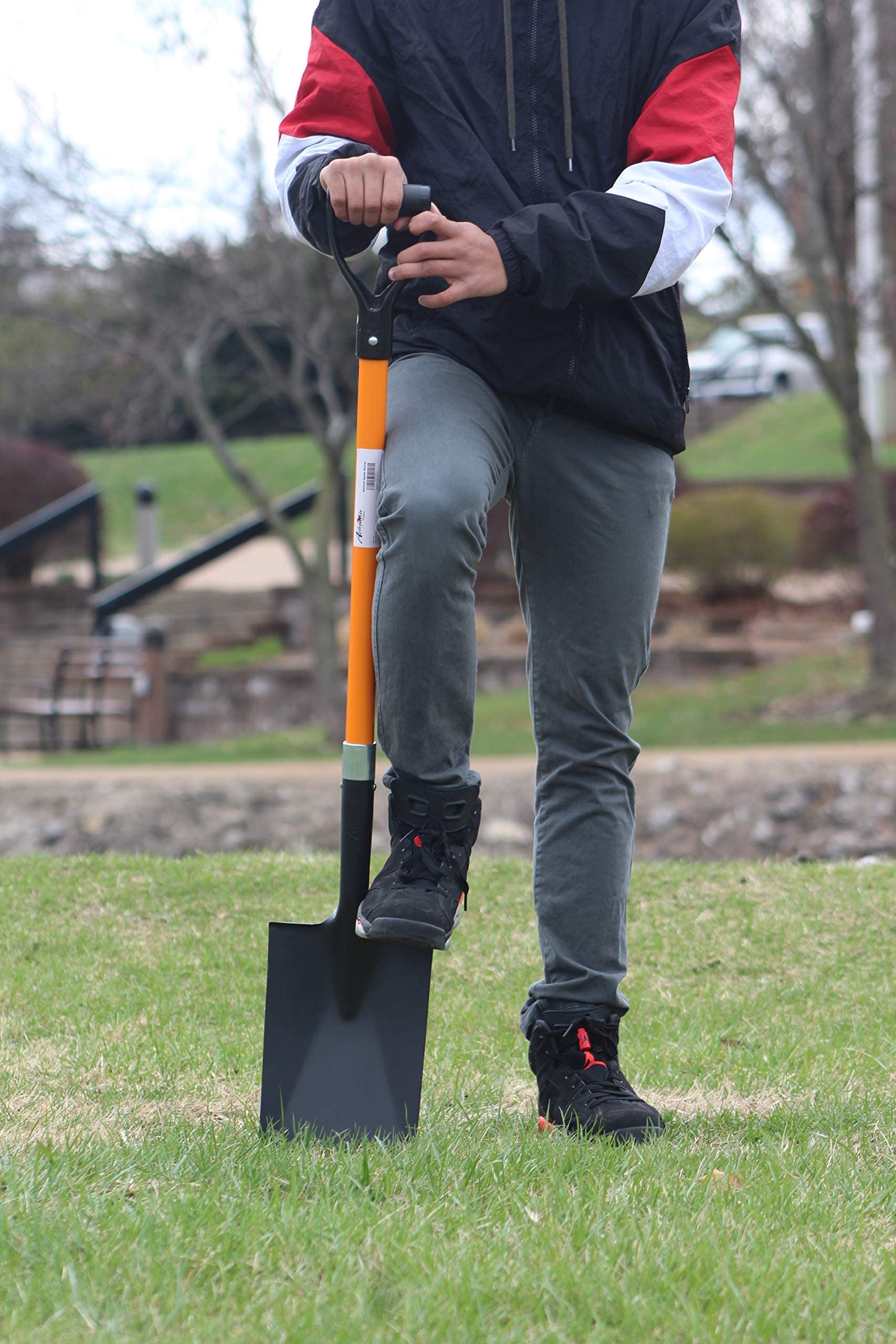 ashman spade placed in garden bed showing reliable tool for landscaping tasks