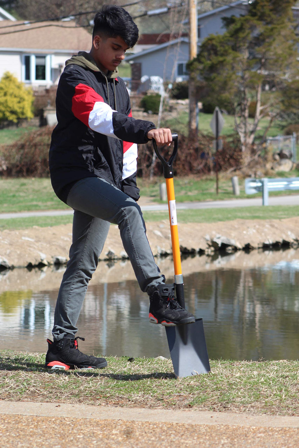 ashman spade next to yard tool for scale showing 41-inch length advantage
