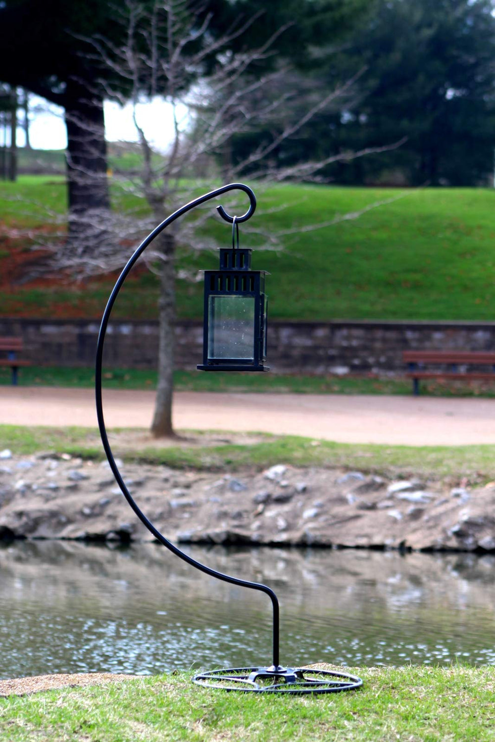 AshmanOnline shepherd hook holding hanging plant basket showcasing decorative display