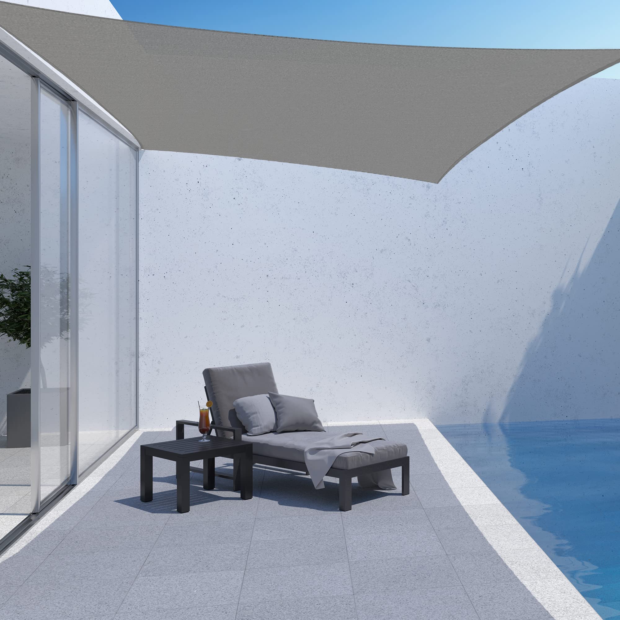 AsterOutdoor shade sail installed over patio providing cooler shaded seating