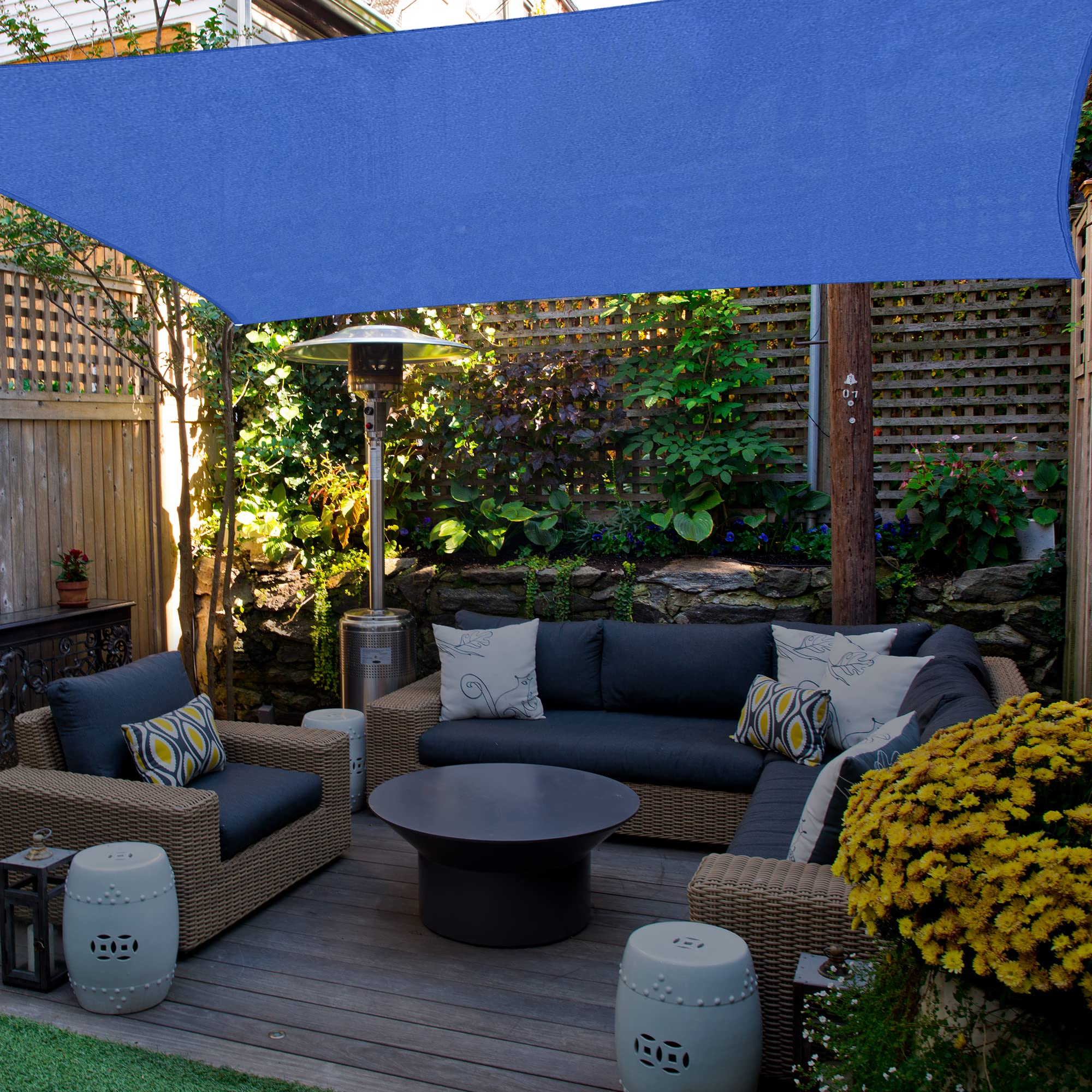 AsterOutdoor blue shade sail in backyard lifestyle scene enhancing outdoor gatherings