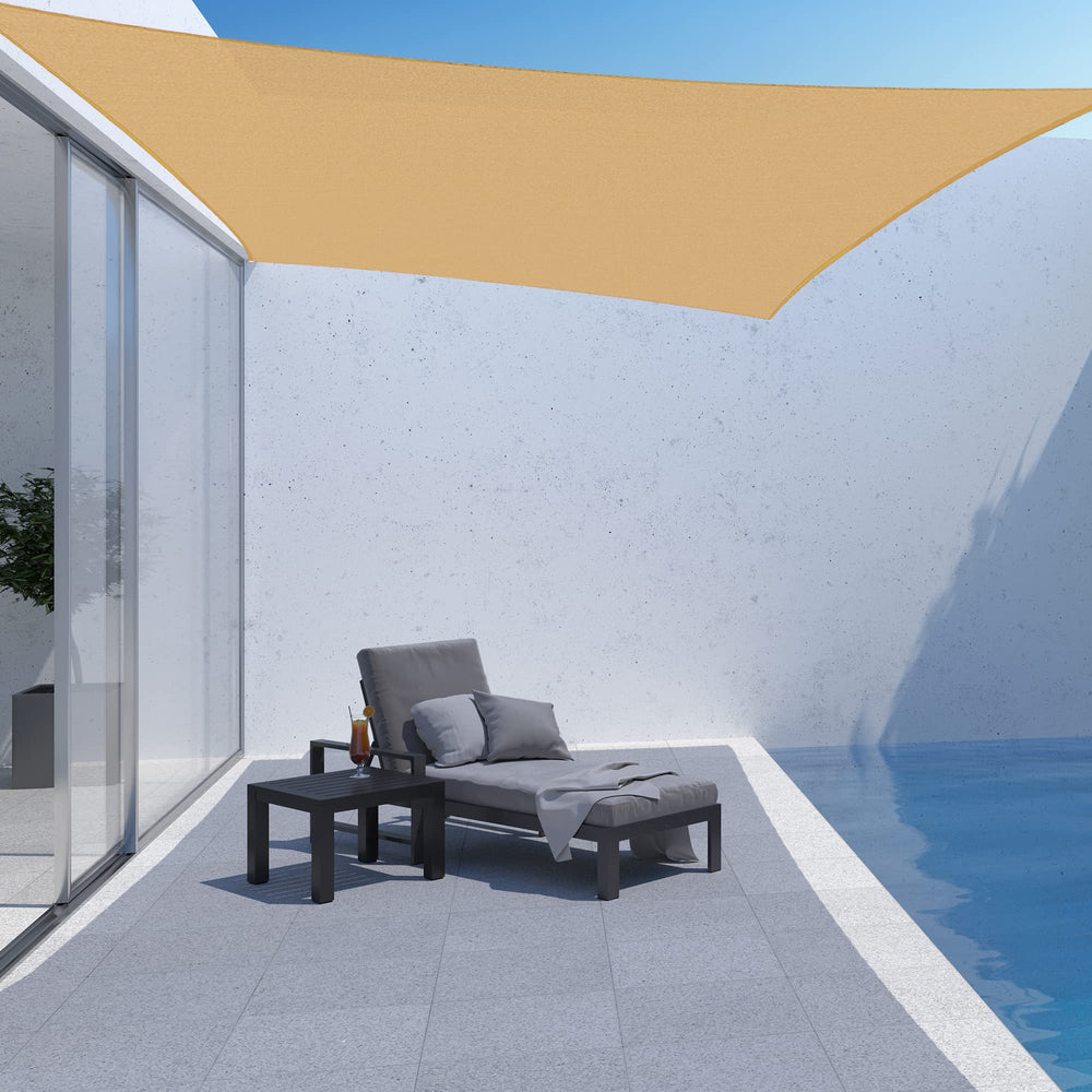 AsterOutdoor shade sail in use over patio creating cooler outdoor seating