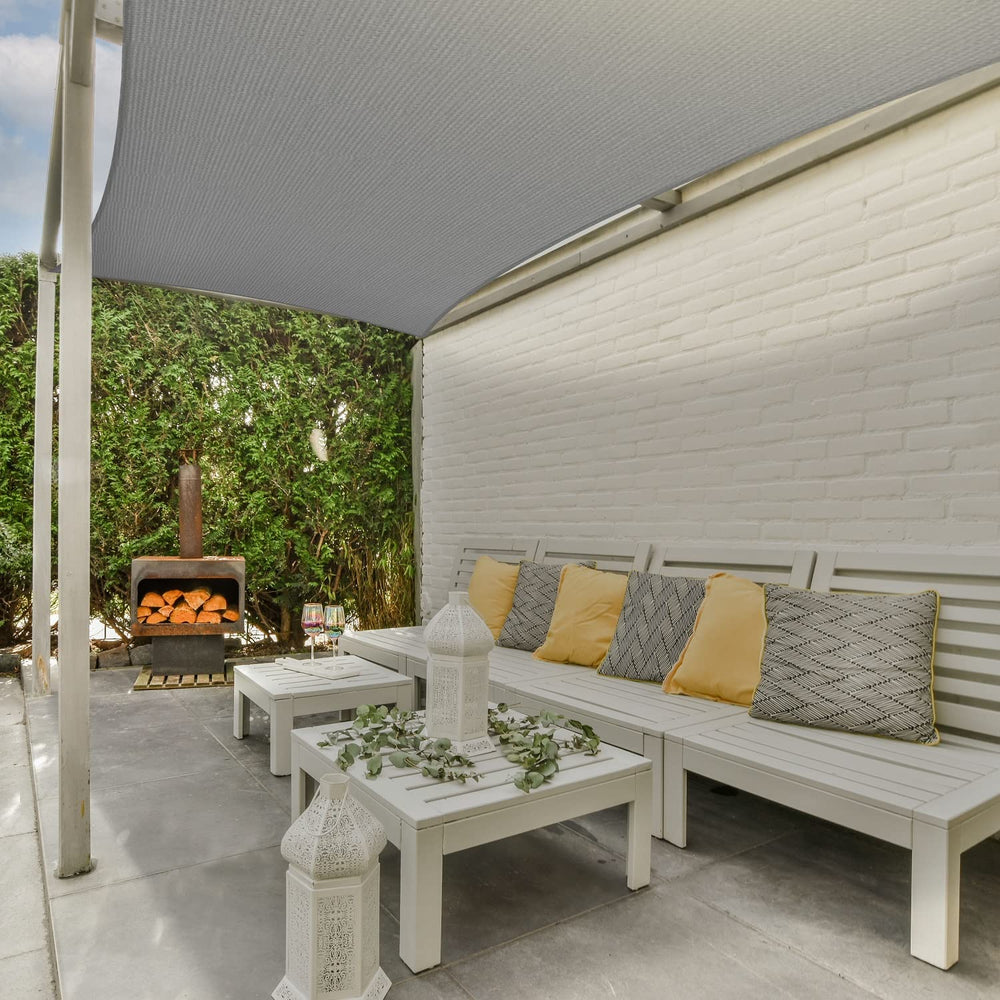 AsterOutdoor shade sail above poolside lounge creating comfortable sun protection