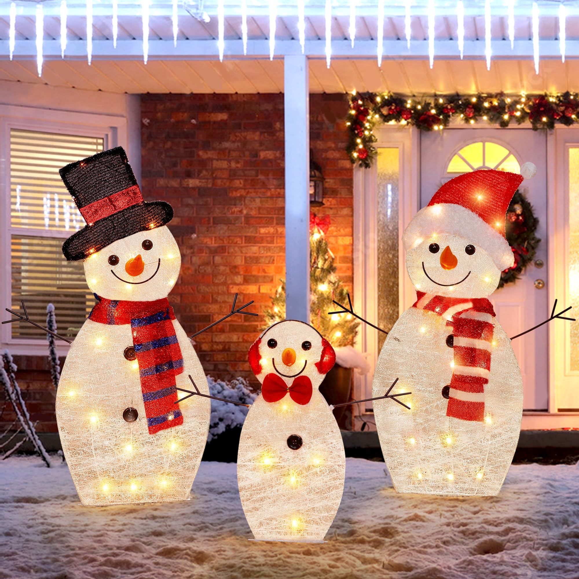 ATDAWN front view of lighted snowman family glowing on lawn for festive curb appeal