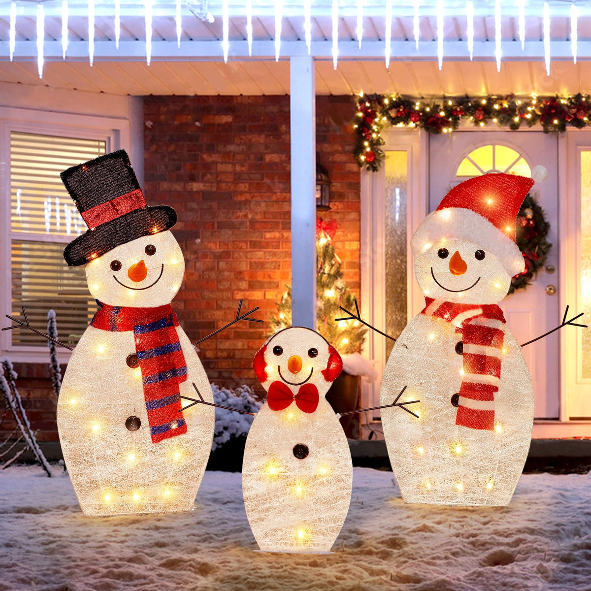 ATDAWN front view of lighted snowman family glowing on lawn for festive curb appeal