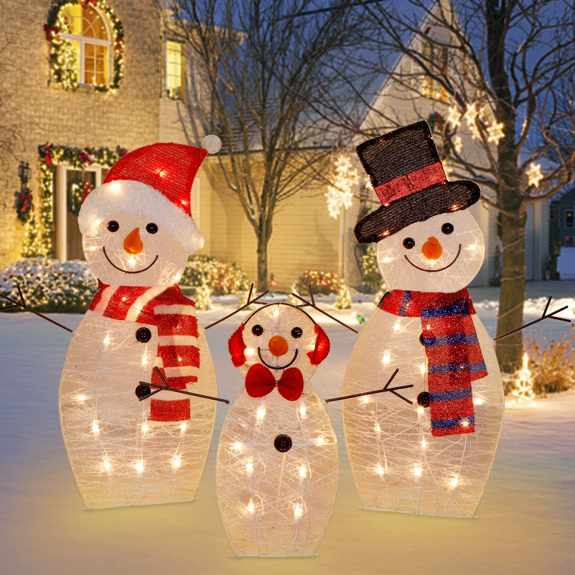 ATDAWN snowman family next to a chair to illustrate size and placement options