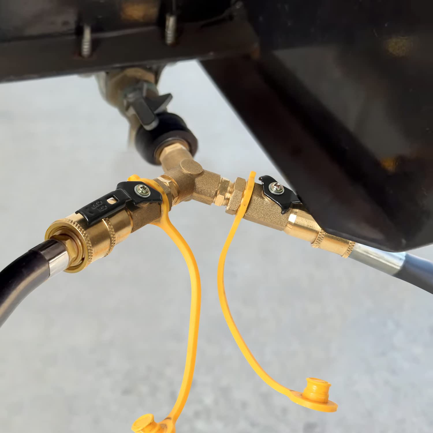 ATKKE Y-splitter held in hand demonstrating compact size and portable convenience