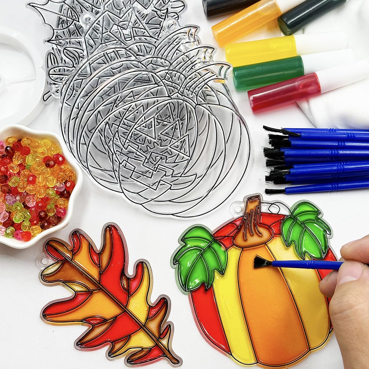 AUEKIV paint bottles and brushes arranged to show color options and easy application