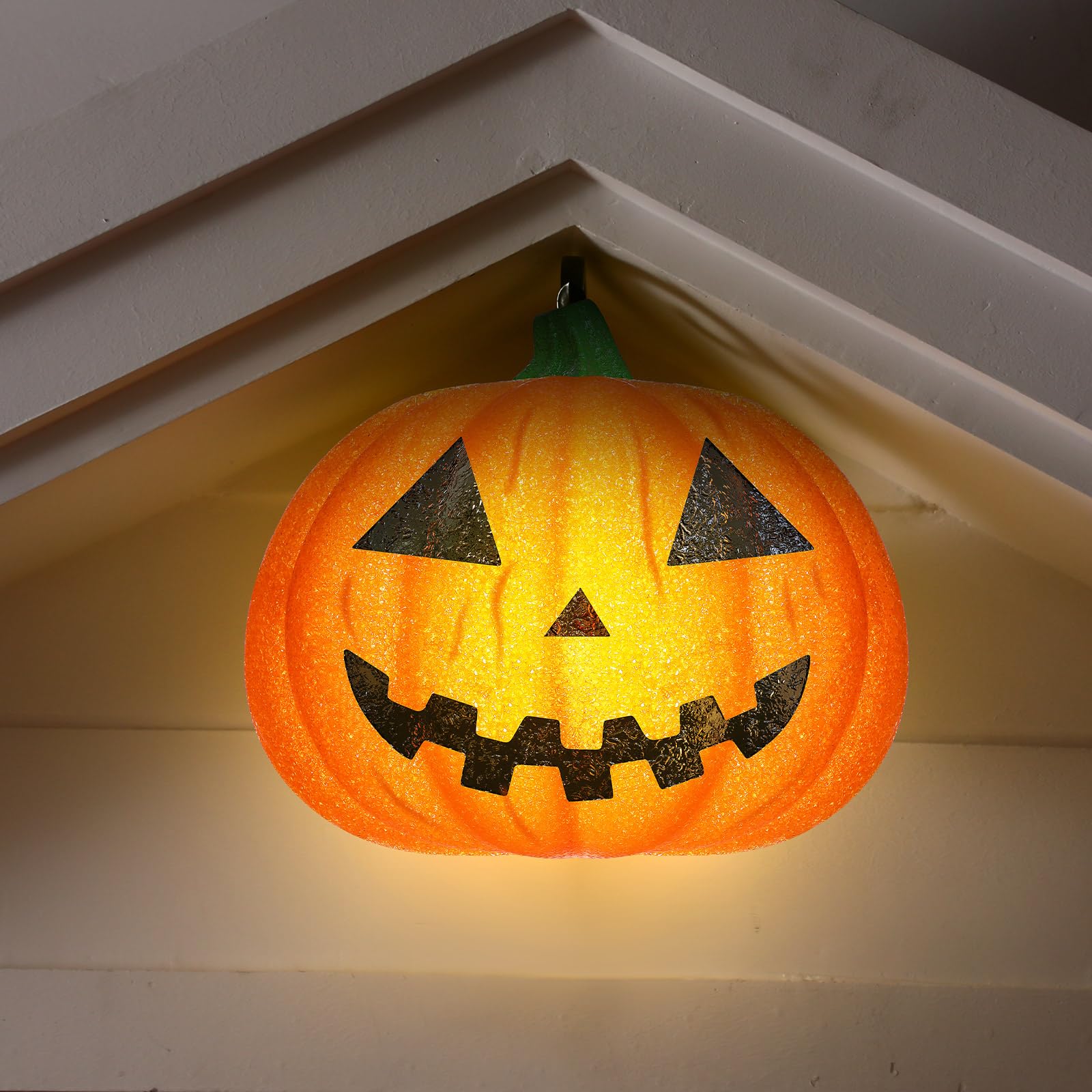 Aurelema glowing pumpkin cover at night creating visible jack-o'-lantern curb appeal