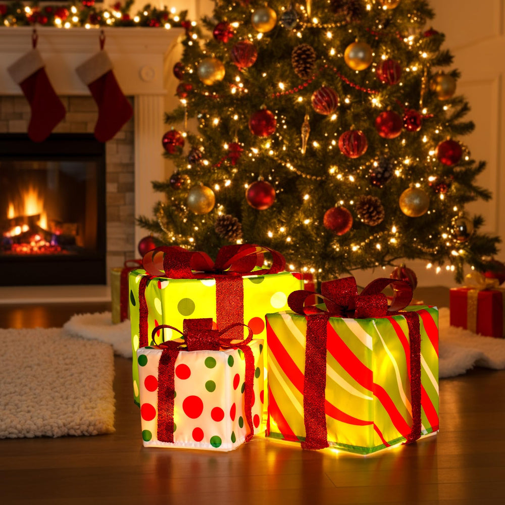Aurelema three illuminated presents on mantel adding layered holiday ambiance