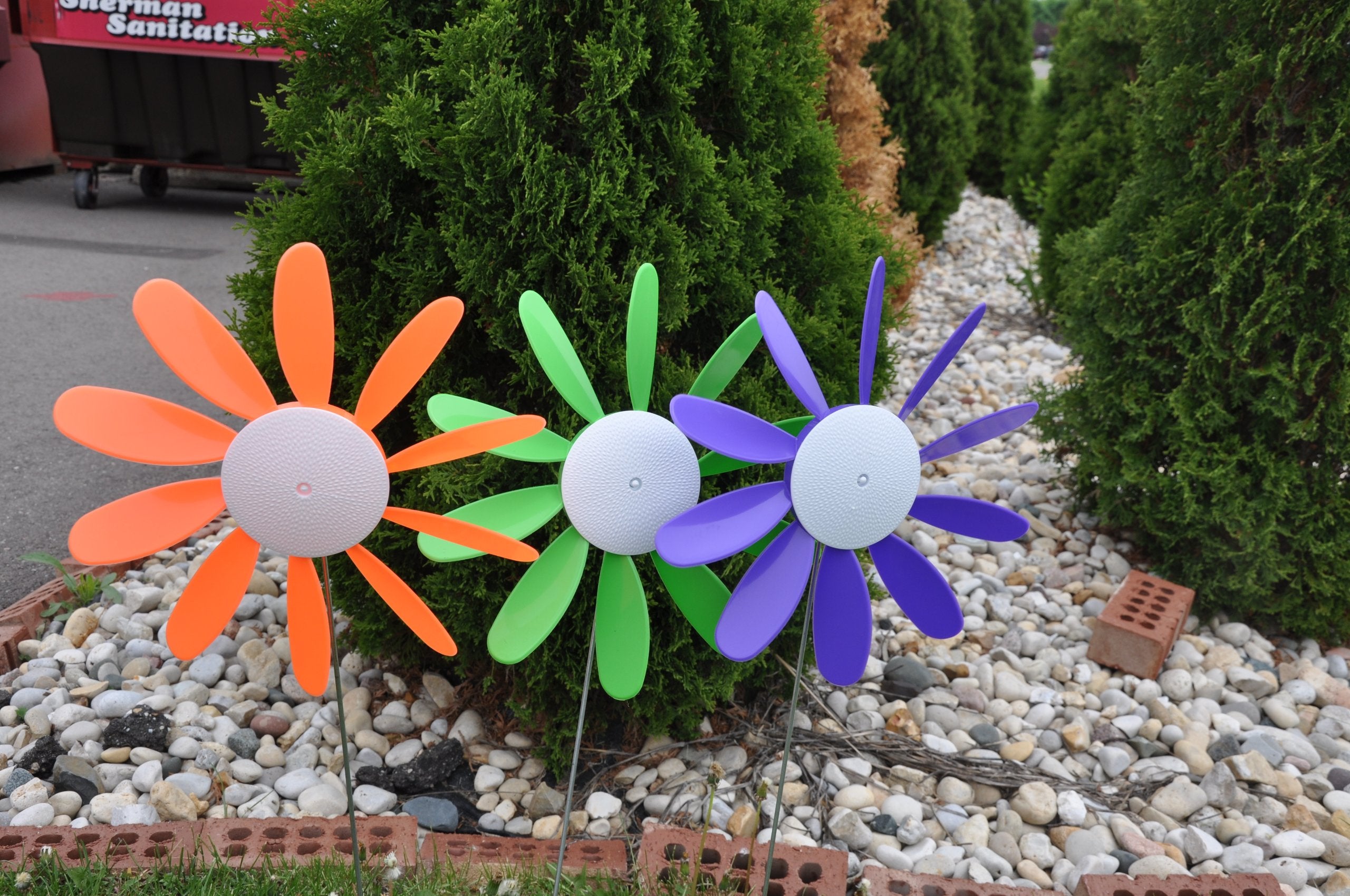 Austin Planter Beloit Plastics spinning daisies used at a backyard party adding festive color and movement