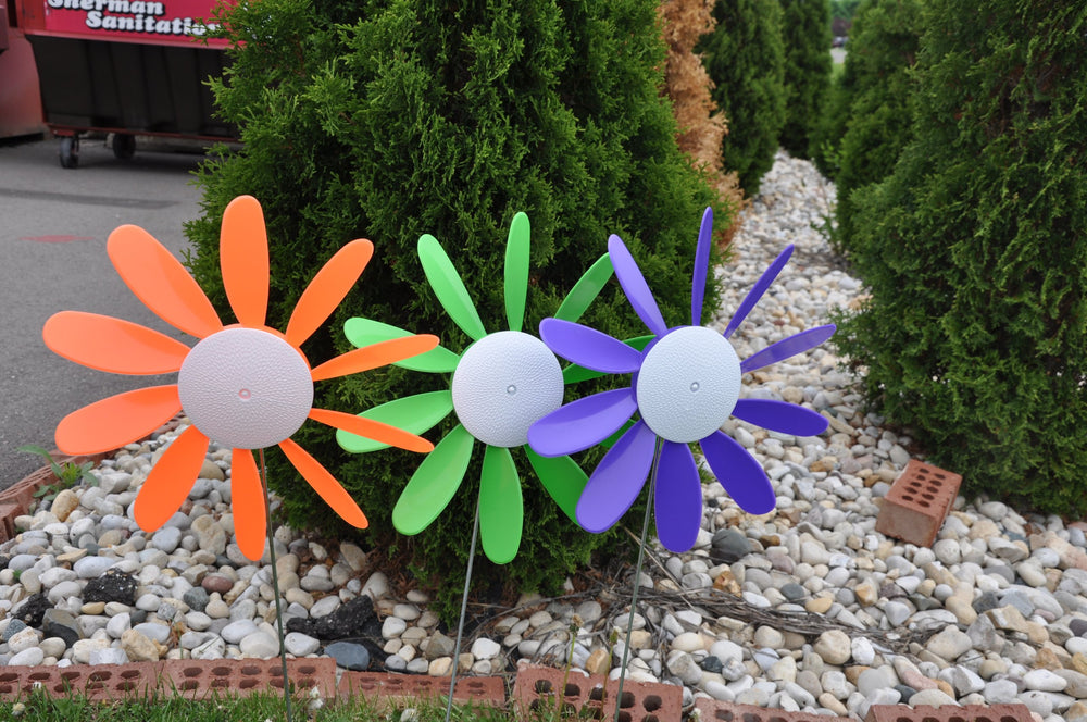 Austin Planter Beloit Plastics spinning daisies used at a backyard party adding festive color and movement