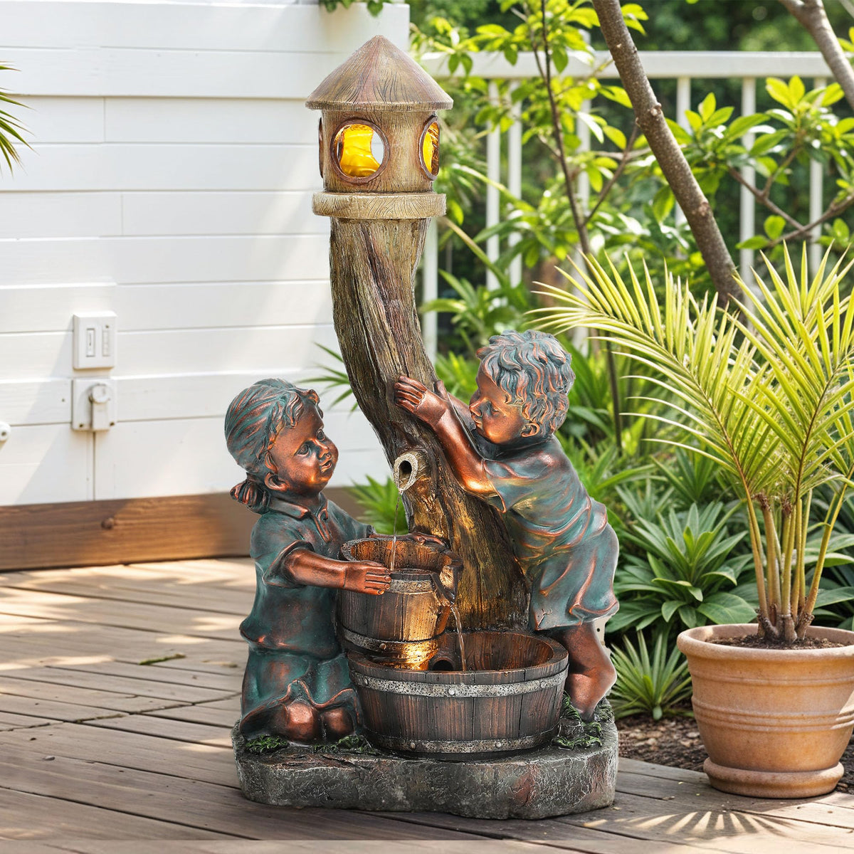 AUTO DAYA front view of boy and girl fountain showcasing focal charm and calming water