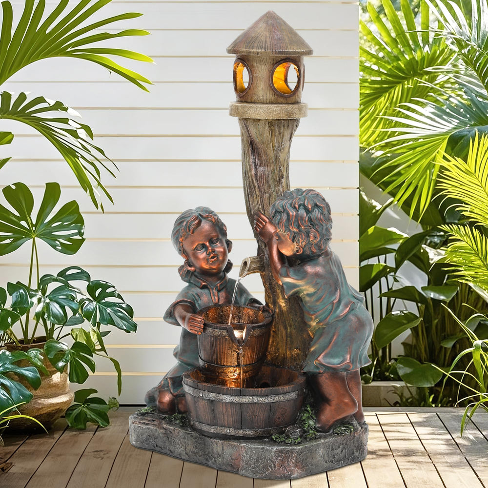 AUTO DAYA fountain on patio beside chair demonstrating size and spatial fit