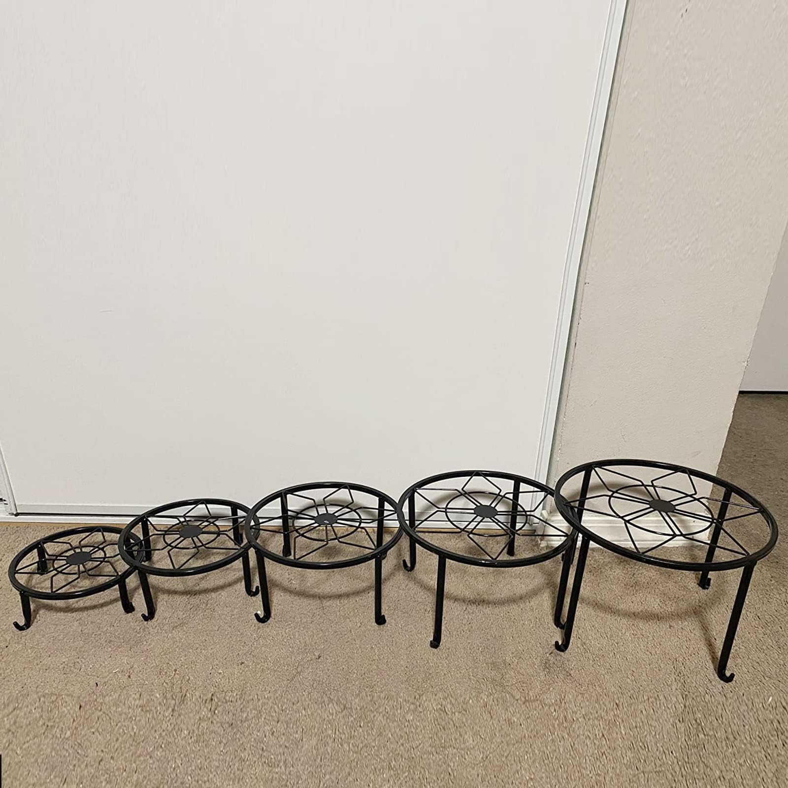Autopromake plant stands on patio resisting weather while elevating pots