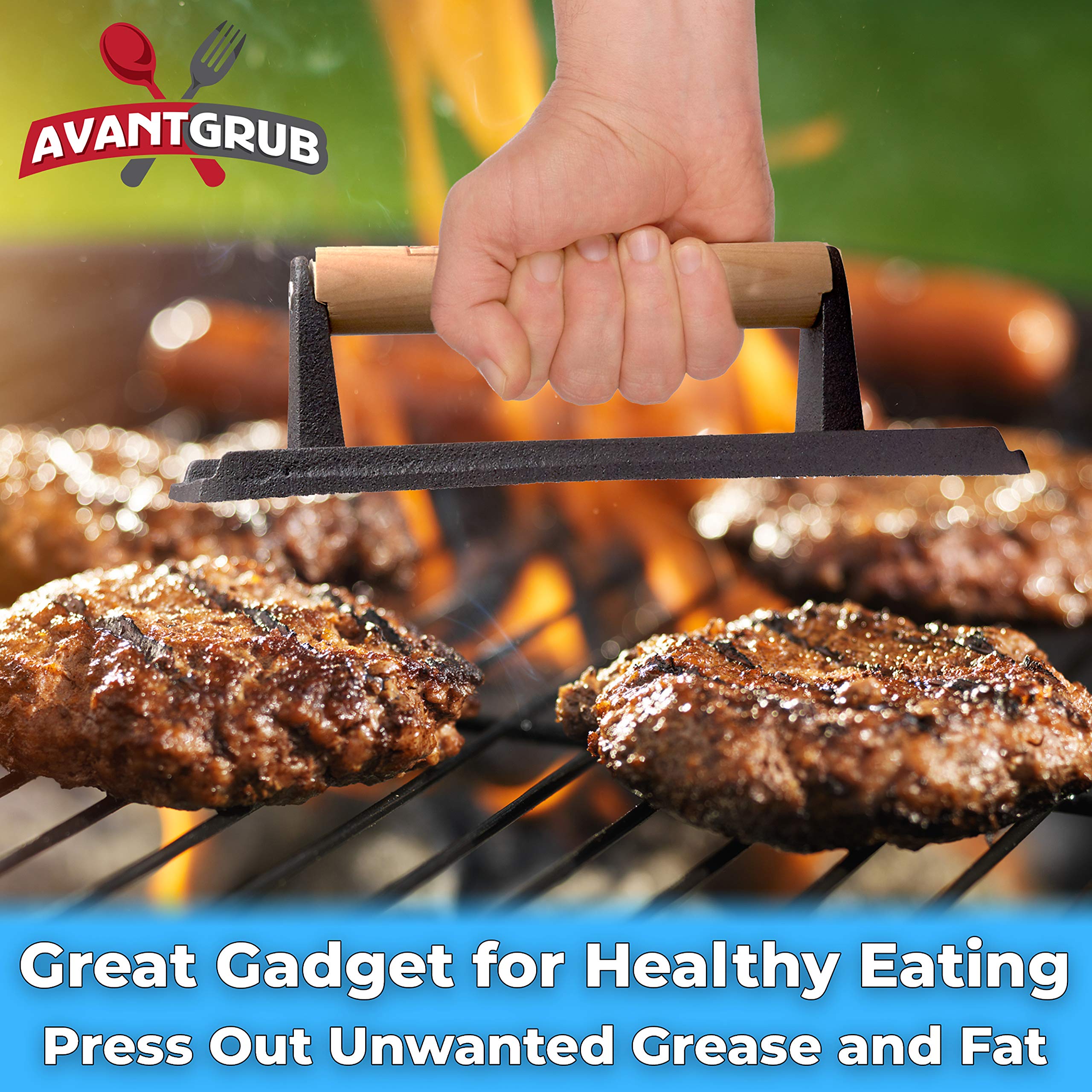 Avant Grub press in use on a hot grill searing steak evenly, faster cook times