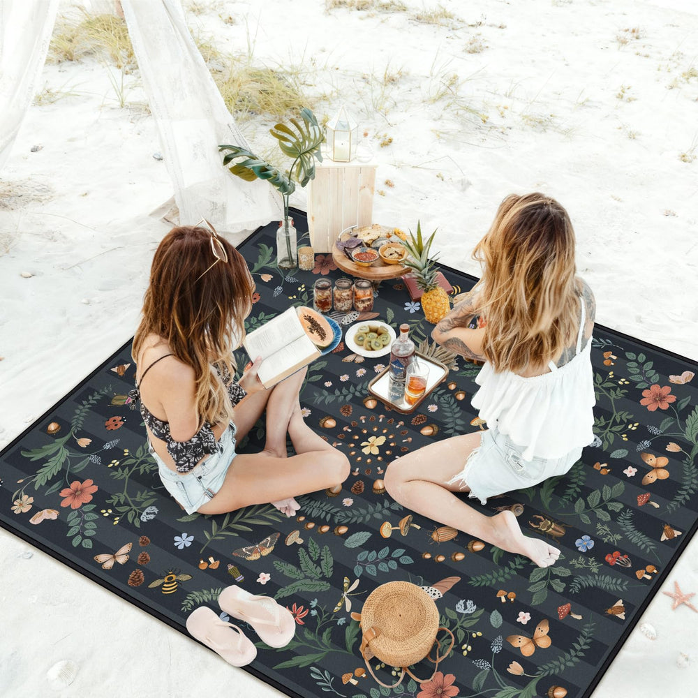 awufncksn beach scene showing sandproof backing and easy clean benefit