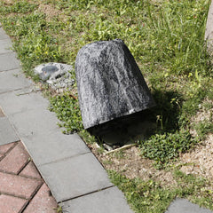 Aytupotin in use covering a sprinkler valve for tidy garden appearance
