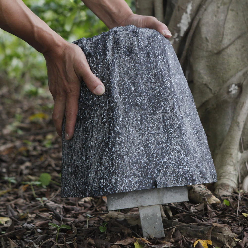 Aytupotin landscape setting among flowers provides discreet concealment benefit