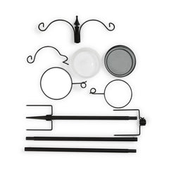 Backyard Expressions five-prong base pressed into lawn for strong anti-tipping support