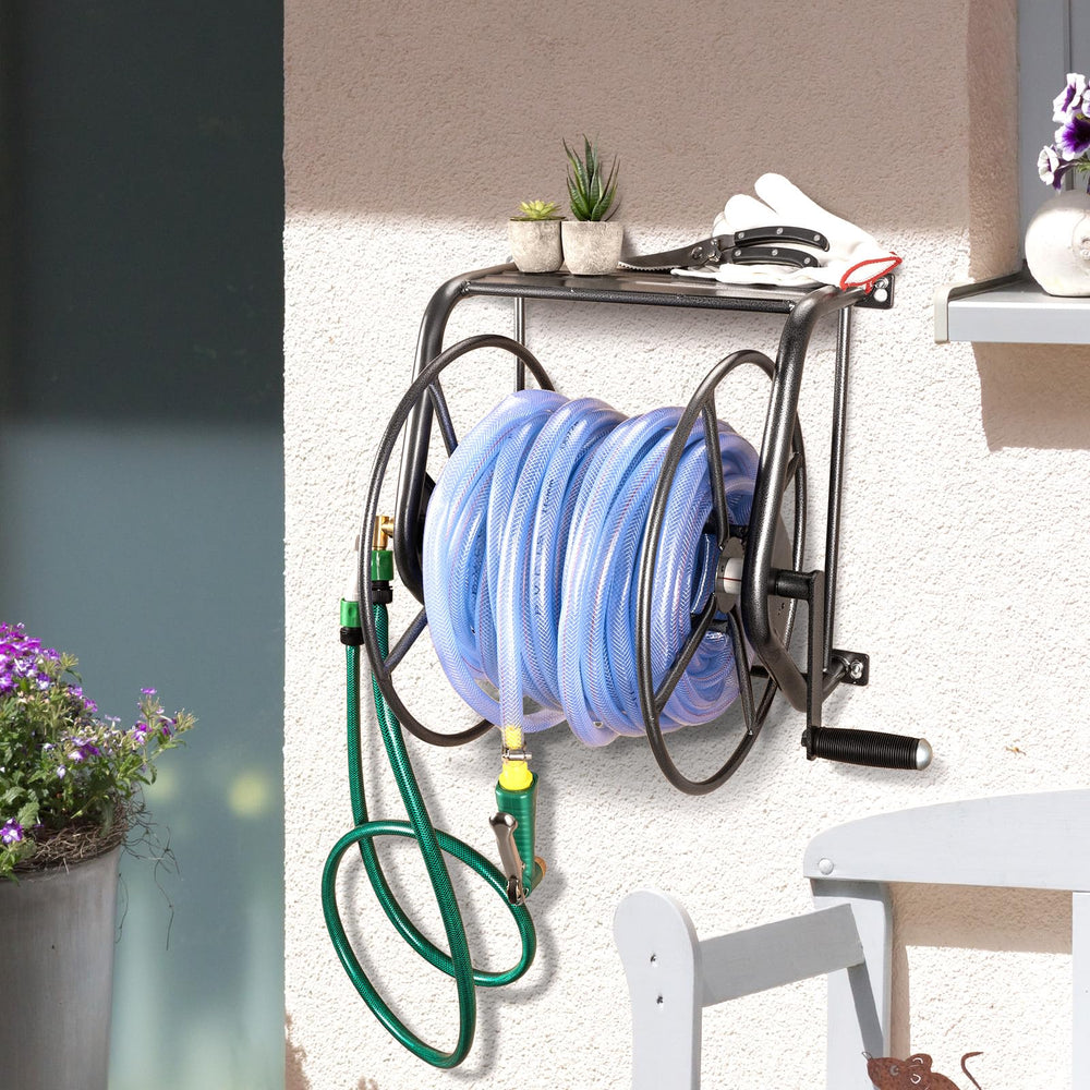 Backyard Expressions reel in use with hose extended for easy watering benefit