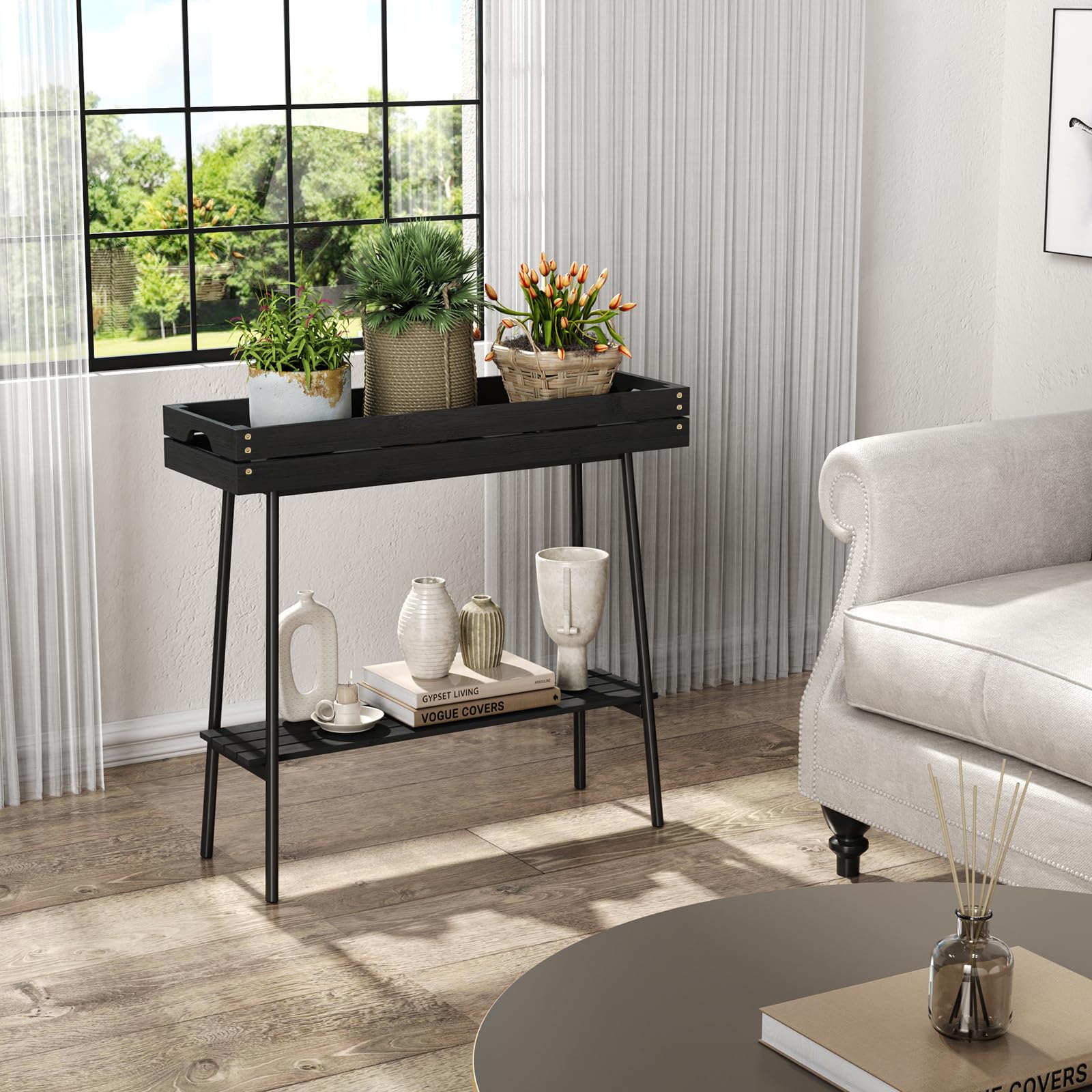 BAMBANG plant stand beside potted plant for scale, shows compact footprint benefit